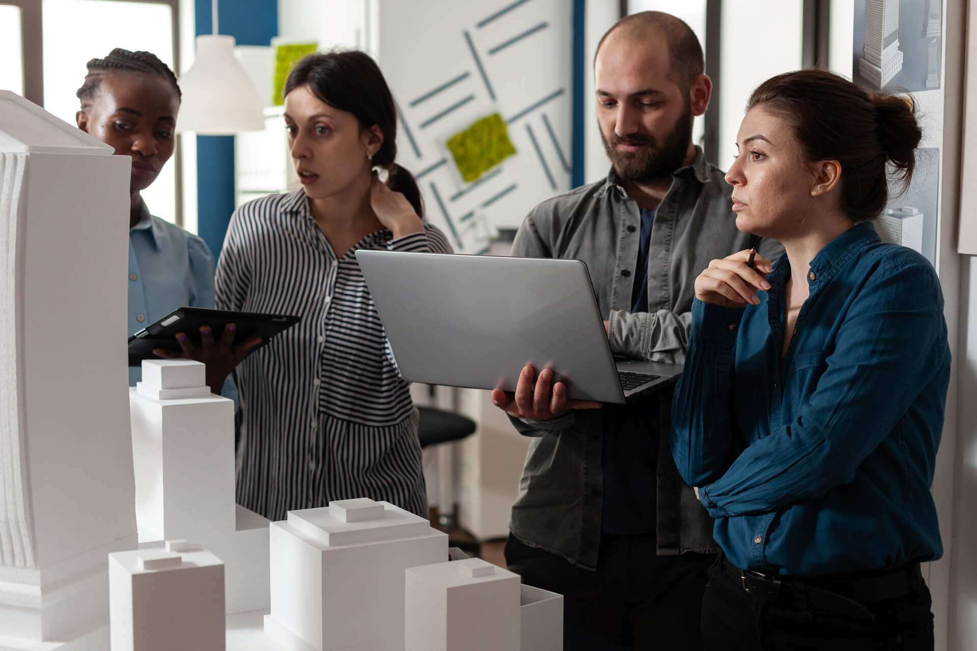 medium-vecteezy_architecture-multi-ethnic-workers-meeting-at-office_4622600_medium (1)